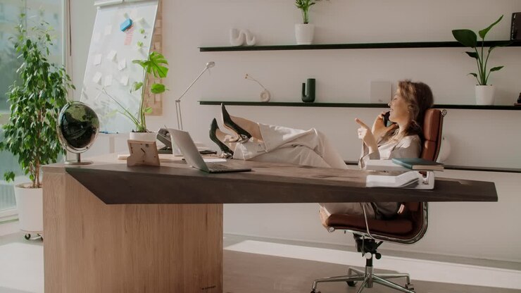 Business Woman Relaxing at Modern Office Desk