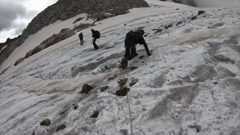 an alpinist falls because of slippery ice on a glacier in the swiss alps, adventure