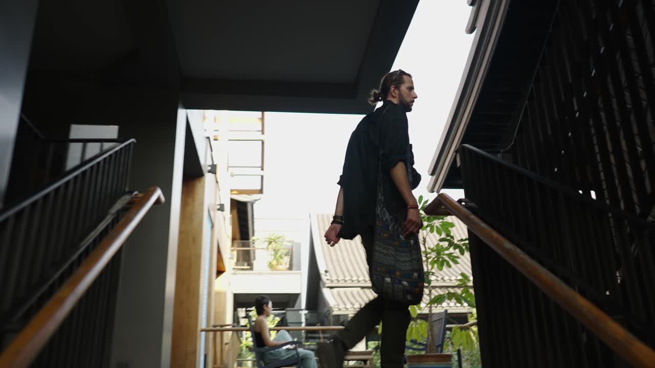 A person walking up stairs in a modern building