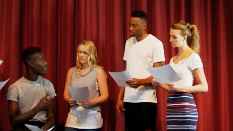 actors discussing their scripts on stage 4k