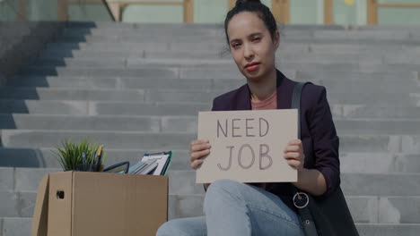 woman seeking employment on stairs