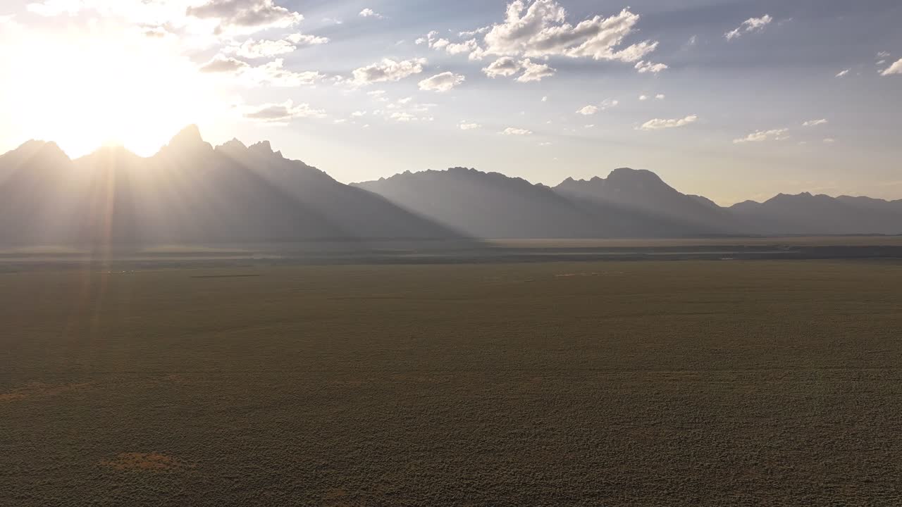 Drone Timelapse of the sun setting over the Teton mountain range