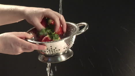 stock footage of washing strawberries