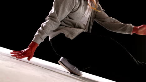 Cool-young-break-dancer-dancing-on-black-background