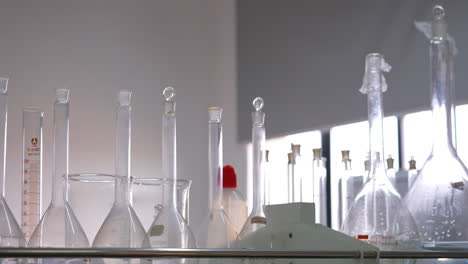 realistic flask laboratory equipment in laboratory. scientific glass tubes, flasks, burner and beaker for chemicals lab test experiment
