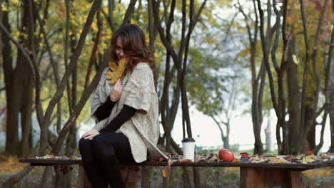 elegant woman walking in a park. beautiful elegant woman walking in a park in autumn , fall concept