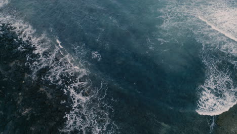 Waves-crashing-aerial-tilt-back