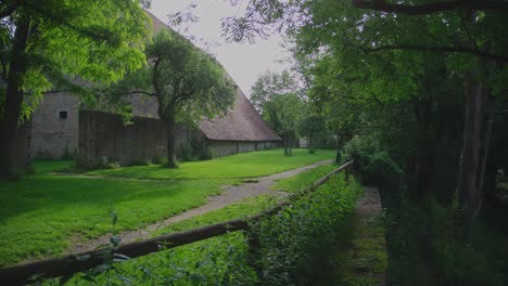 serene garden path leading to a historical building in rothenburg ob der tauber
