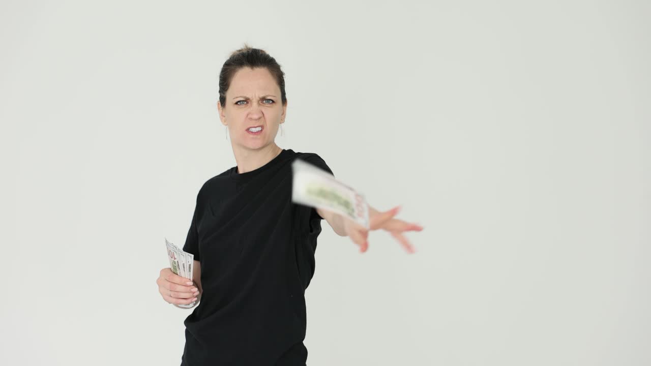 Woman throwing money away