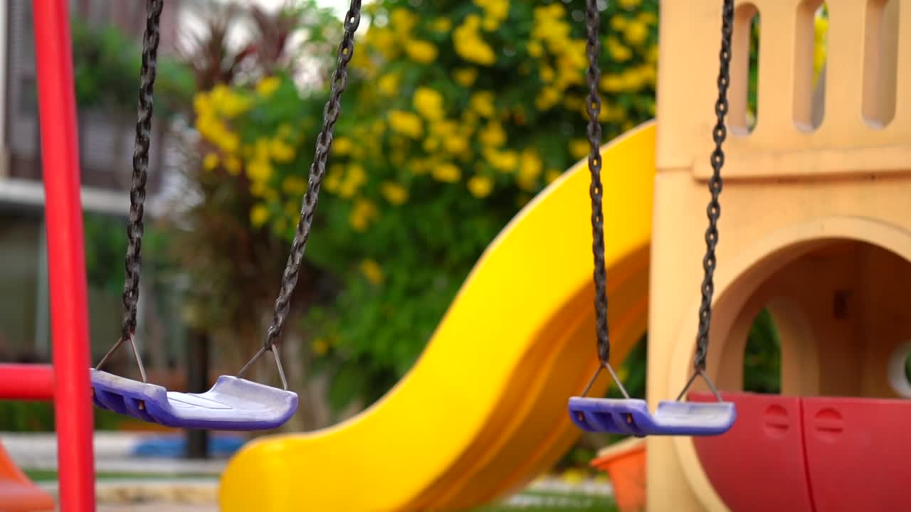 Empty swing kids playground colorful