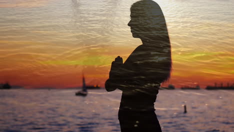 silhouette of a woman beside an ocean