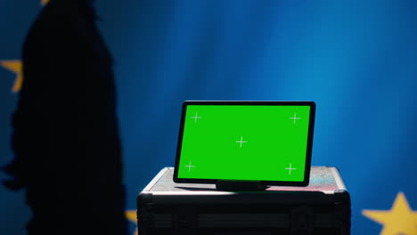 european union agency operator using military tech on green screen tablet