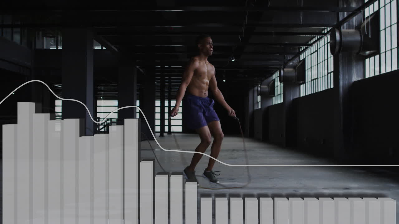 Jumping rope, man in industrial space with fitness animation graph overlay