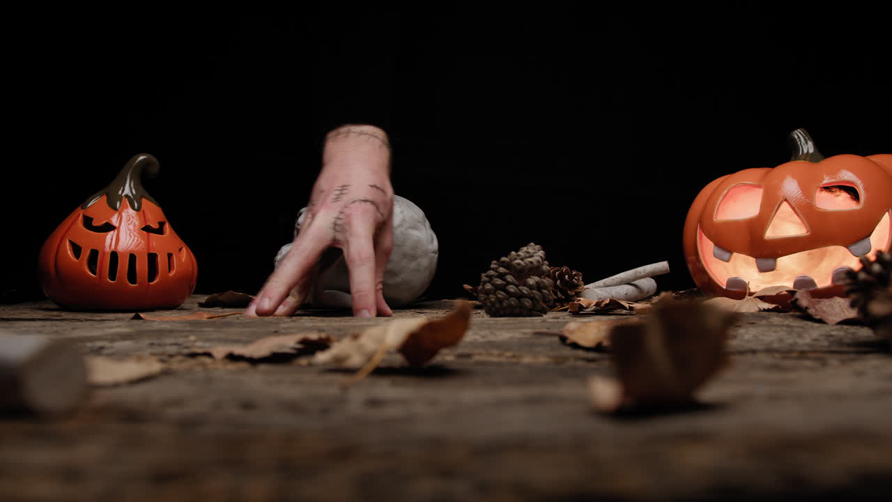 Horror Hand Walks Near Halloween Pumpkins