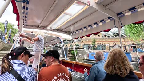 tourists enjoy a scenic canal boat ride