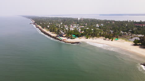 Panoramic-Aerial-View-Of-Sandy-Beach-In-Tropical-Village-In-Kerala,-India