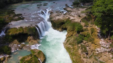 aerial: beautiful tropical waterfall in mexico rainforest, travel destination
