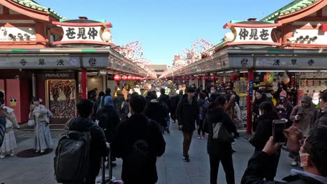 crowded tourist spot with people and traditional architecture