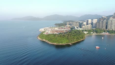 Hong-Kong-Wu-Kai-Sha-beach-and-coastline-with-residential-skyscrapers-in-the-background,-Aerial-view