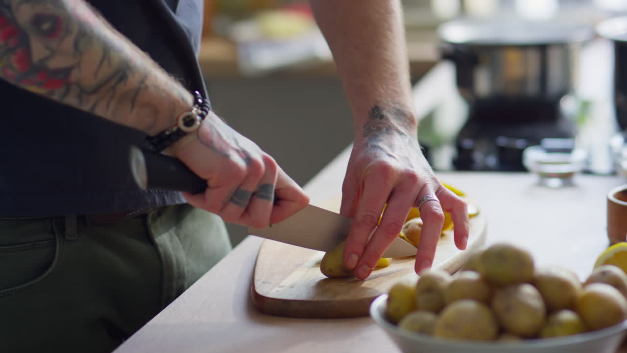 Chef Cutting Baby Potatoes before Cooking