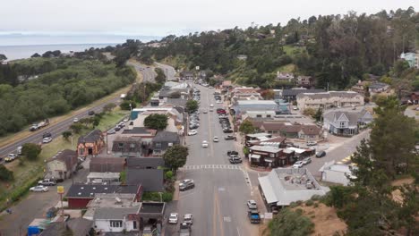 aerial descending close-up shot of charming cambria village on the central coast of california