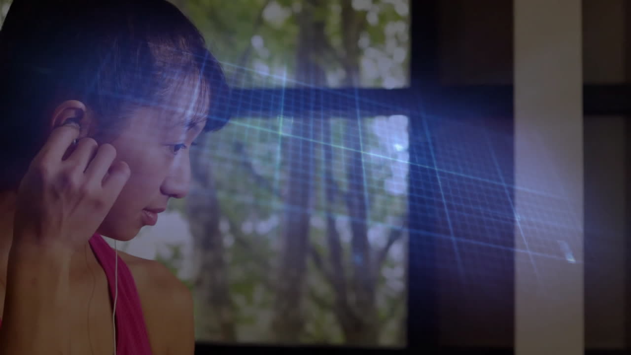 체육관에서 이어폰을 착용하는 아시아 여성에 대한 심장 측정기의 애니메이션