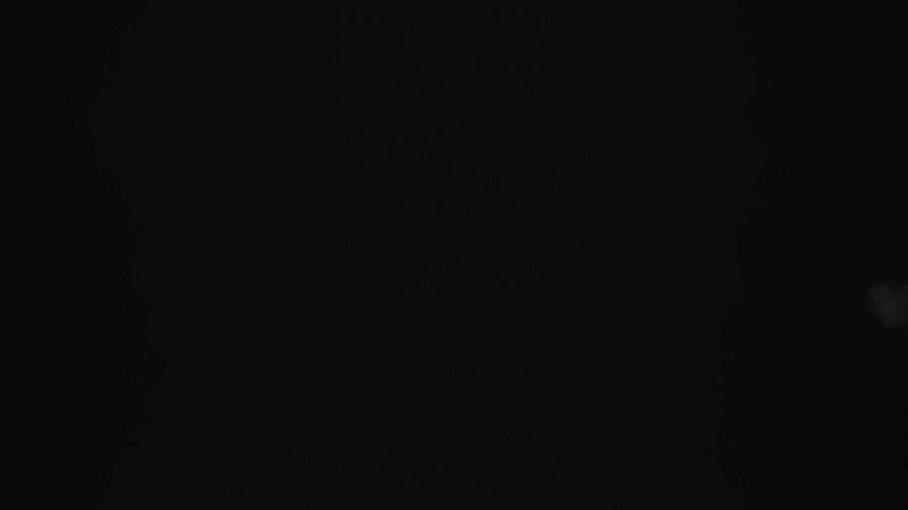 White water vapour on a black background. Close-up shot 4k