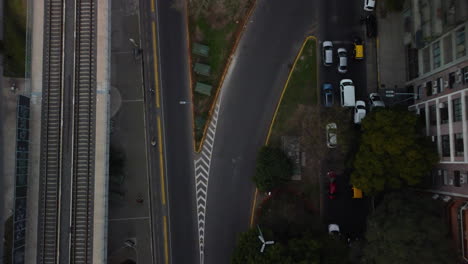 Road-junction-in-Buenos-Aires,-near-railway-tracks,-road-markings,-traffic