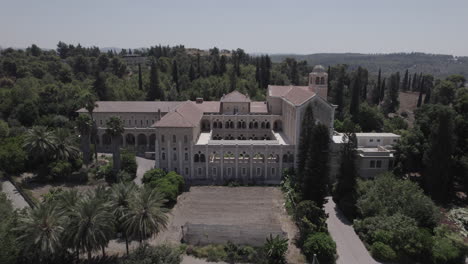 monastery of the silent monks, latrun - located at the top of the hill in ayalon valley, the monks lifestyle based on simplicity and harmony with nature - tilt up reveal shot