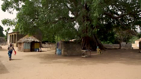 walking down a street in a small village in senegal