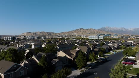 suburb and business offices on the foothills in lehi, utah - push in aerial flyover