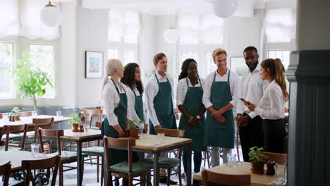 team meeting of management and staff before restaurant opens