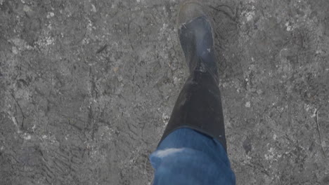 muddy boots running down muddy path in slow motion