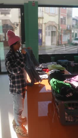 sorting and donating clothes