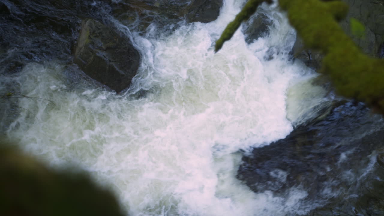 Top Down View Camera Boom Over the Edge of Cliff to Seymour River