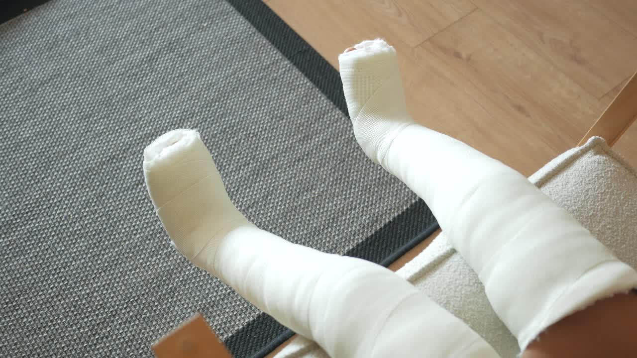 Child with Broken Legs in Casts