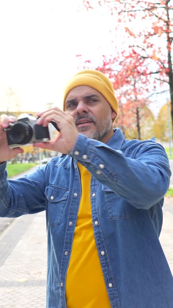 Man taking photos in autumn