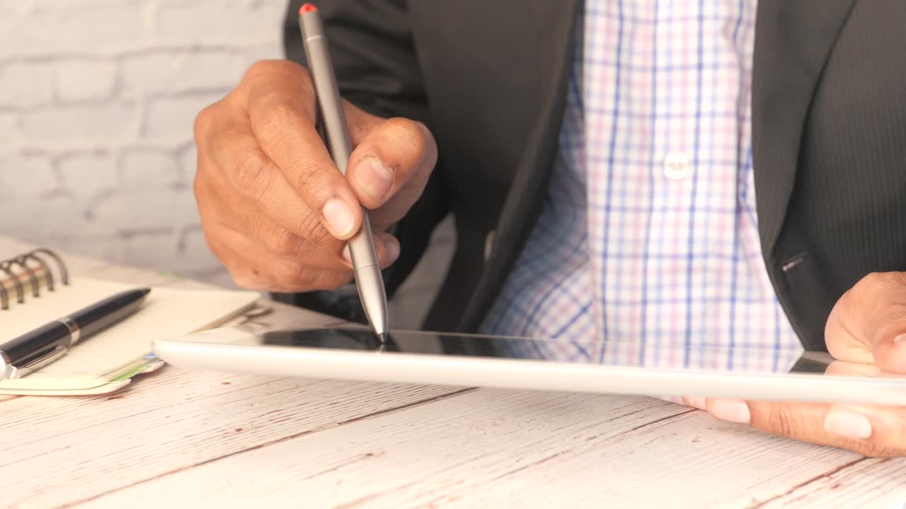 Businessman Using Tablet and Stylus