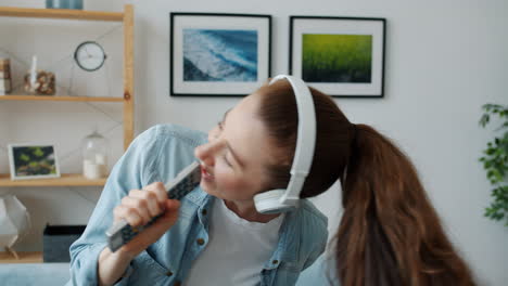 woman dancing and singing at home