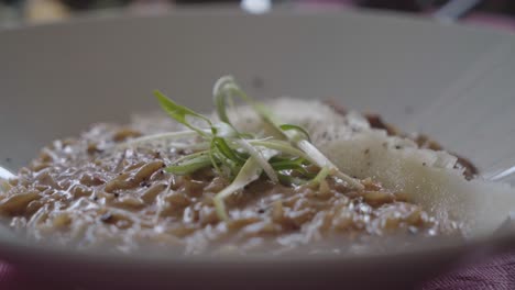 delicious plate of risotto served with micro greens at a high-end luxury hotel in greece