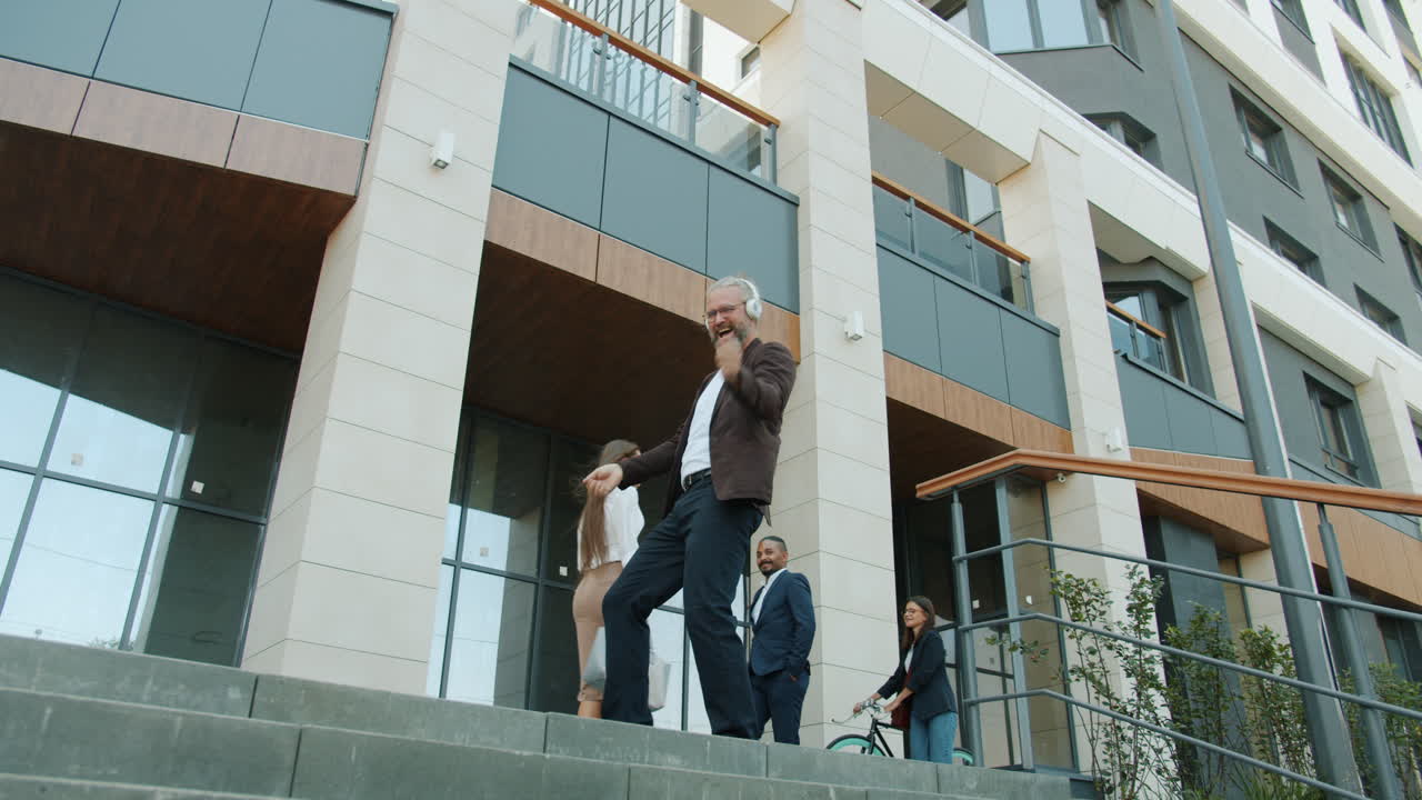Man Dancing on City Stairs