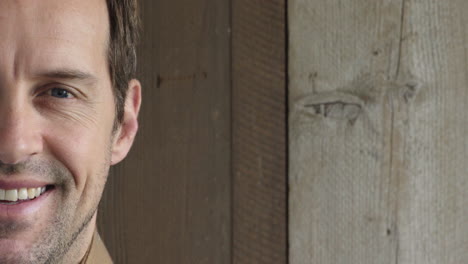 portrait close up of young man smiling happy satisfaction successful caucasian male on wooden background