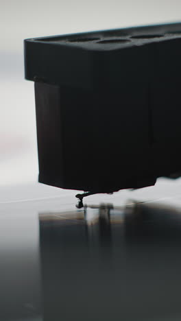 close up of a record player stylus