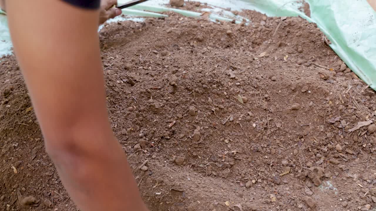 natural soil preparation with hand-mixed organic fertilizer at garden outdoor