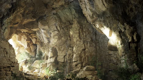 Beautiful cave with light illuminating stone formations in nature