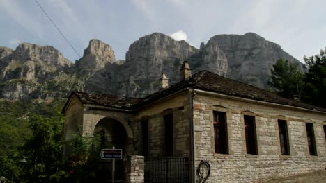 papigo village in greece with tymfi mountain in the backgound