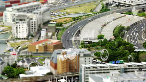 tilt-shift effect on urban landscape with digital data processing animation overlay