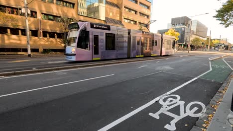 a tram moves along a city street