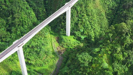 agas-agas beam bridge with green mountains on the pan-philippine highway in sogod, southern leyte, philippines