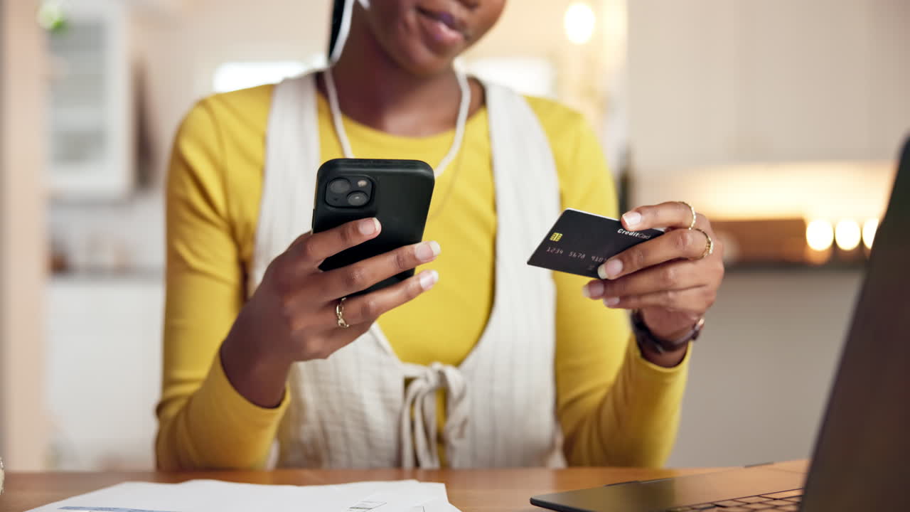 Woman making online payment with credit card and smartphone
